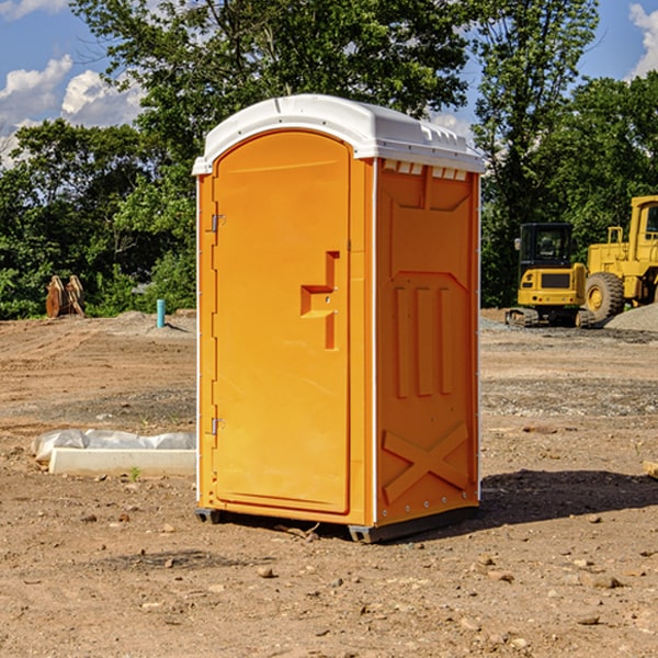 what is the cost difference between standard and deluxe portable restroom rentals in Gibson